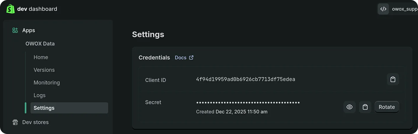 Shopify developer dashboard displaying the OWOX Data app settings page. The left sidebar lists navigation options. The main section shows Credentials with a Client ID value and a masked Secret. There are buttons to copy, view, or rotate the secret. The interface has a dark theme and a calm, professional tone.